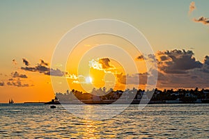 Sunset, view of Sunset y Island from Mallory Square, Key West, Florida, US