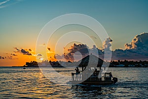 Sunset, view of Sunset y Island from Mallory Square, Key West, Florida, US