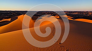 Sunset view to Tin Merzouga dune at Tassili nAjjer national park in Algeria photo