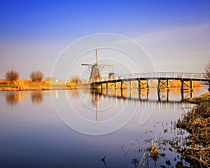 Sunset view at typical windmill at Kinderdijk, Holland.