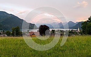 a sunset view of the village at the lakeside