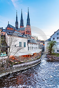 Sunset view of white building of Uppland museum and cathedral in Uppsala, Sweden