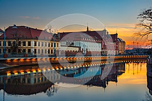 Sunset view of Wroclaw downtown at the Odra riverside with water reflection, Poland