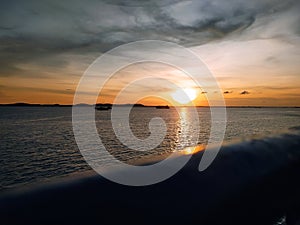 The sunset is visible from the ship