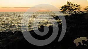 Sunset on the Volcanic Shoreline of Kaunaoa Bay