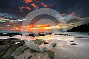 Sunset water wave stone in Lan Hin Khao Beach Mueang Rayong ,Thailand