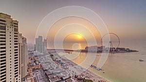 Sunset waterfront overview Jumeirah Beach Residence JBR skyline aerial timelapse with yacht and boats