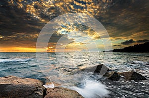 Sunset wave rock on the beach