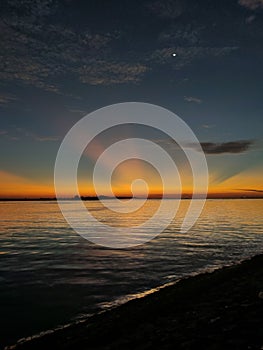 Sunset on a waveless beach