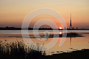 Sunset, Western Dvina river Davgava river, summer, evening. Natural landscape of the Baltics.