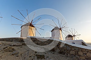 Sunset of White windmills and Aegean sea on the island of Mykonos, Greece