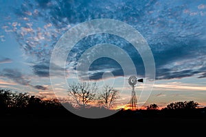 Sunset with a Windmill in Ingram Texas photo