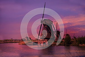 Sunset at the windmills in Kinderdijk in Netherlands