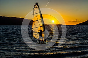 Sunset windsurfing, watersports