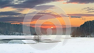 Sunset on winter dam in Rimov on river Malse