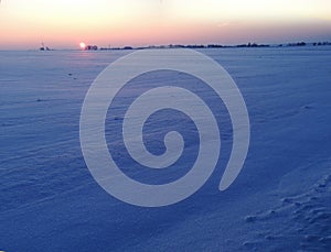 Sunset in winter fields