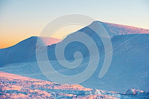 Sunset in winter mountains