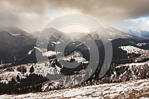 Sunset in winter mountains with dramatic light