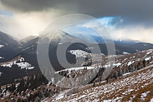 Sunset in winter mountains with dramatic light