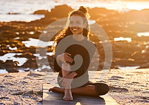 Sunset, woman with yoga mat and at beach happy with a lens flare. Fitness or exercise, meditation or freedom and female