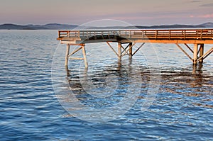 Sunset on a wooden fishing pier, Sidney, BC photo