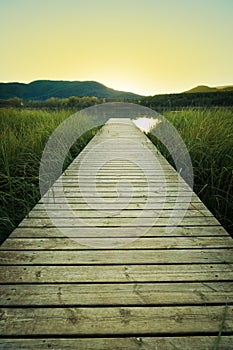 Sunset on the wooden pier of Lake Banyoles