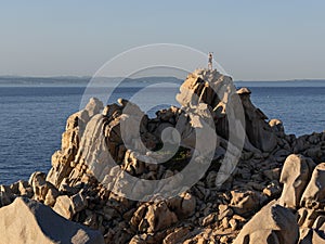 Sunset Yoga on Rocks in Capotesta in Sardinia photo