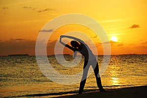 Sunset yoga woman