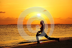 Sunset yoga woman