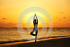 Sunset yoga woman