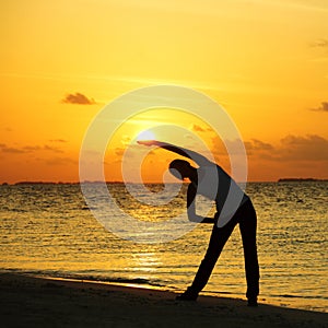 Sunset yoga woman