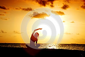 Sunset yoga woman