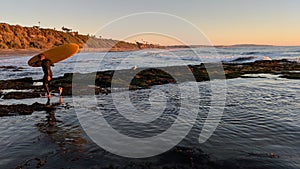 Sunsets and Surfers at Swamis Reef Surf Park Encinitas California.