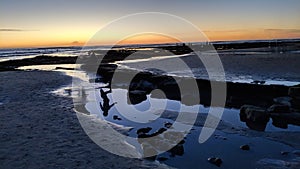 Sunsets and Surfers at Swamis Reef Surf Park Encinitas California.