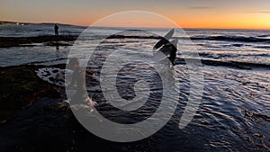 Sunsets and Surfers at Swamis Reef Surf Park Encinitas California.