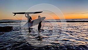 Sunsets and Surfers at Swamis Reef Surf Park Encinitas California.