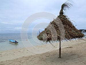 Sunshade on a beach in cloudy weather