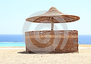 Sunshade by pool and sea