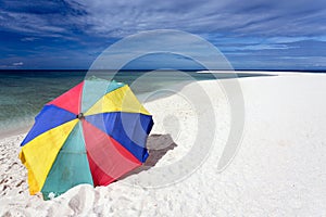 Sunshade on tropical white beach