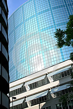 Sunshades and dutch glass building in sunlight photo