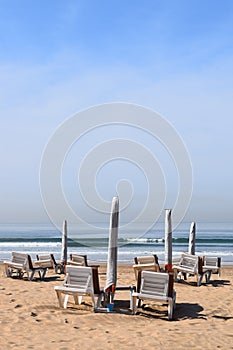 Sunshades and sunlounger on the beach