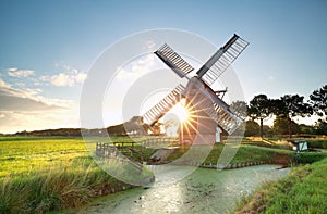 Sunshine behind Dutch windmill