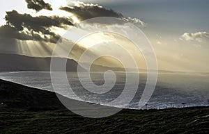 Sunshine through clouds and over the sea near Llandudno, Wales, UK