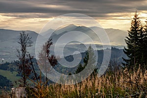Sunshine through dark clouds. Cloudy sky sunrays. Sunrays in cloudy sky