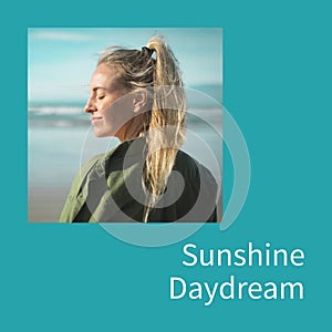 Sunshine daydream text on blue with happy caucasian woman smiling in sun with eyes closed by sea