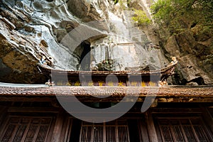 Sunshine hitting the ancient wooden temple roof at the Bich Dong Pagoda, Tam Coc photo