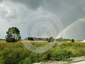 Sunshine rain and rainbow