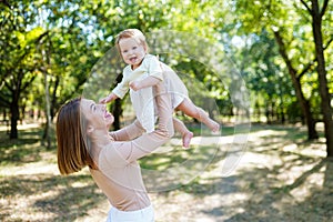 Sunshine spring summer day mother playing with her child