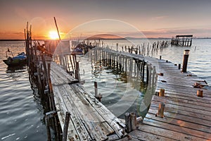 Sunshine from a sunset on a old pier