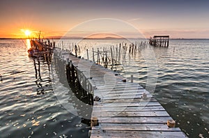 Sunshine from a sunset on a old pier